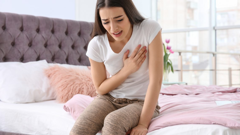 girl clutching heart